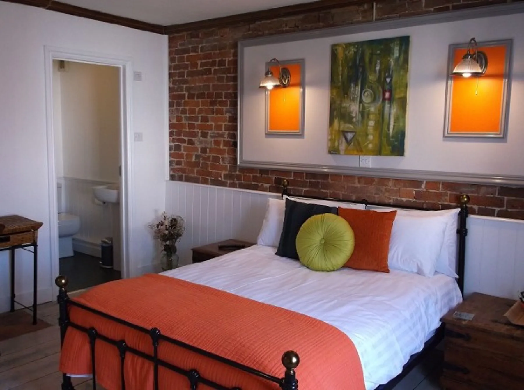 The quad family room with exposed brick wall